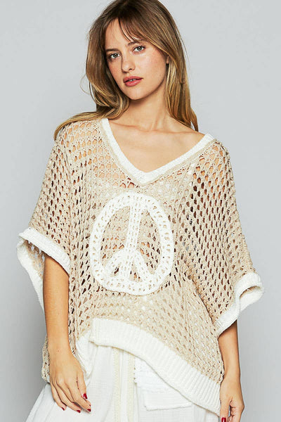 Oversized v-neck short sleeve peace sign top