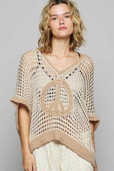 Oversized v-neck short sleeve peace sign top