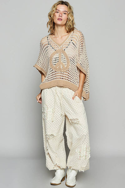 Oversized v-neck short sleeve peace sign top